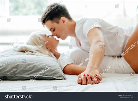 Passionate couple having sex in bed